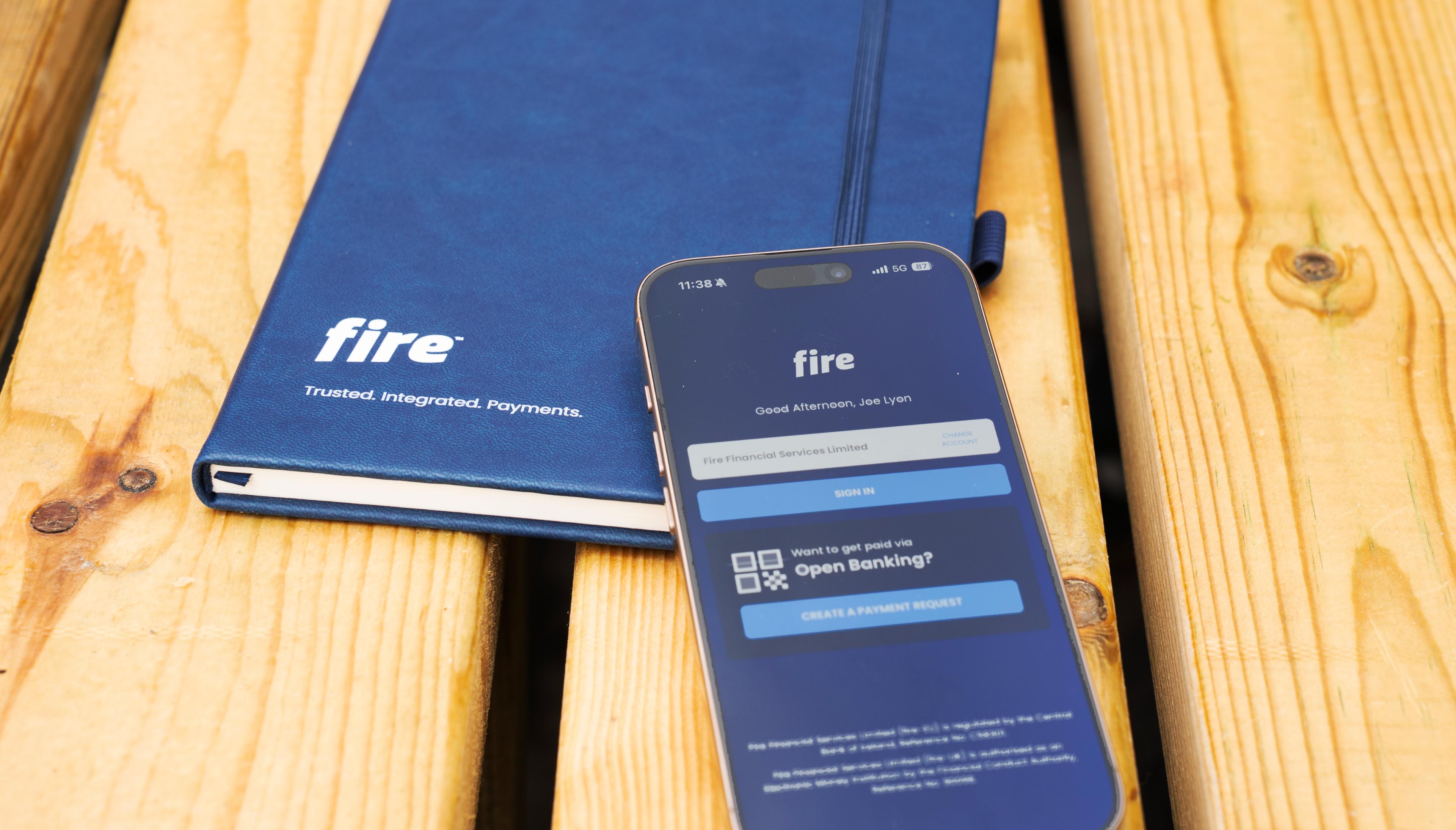 Phone and notebook featuring Fire branding.